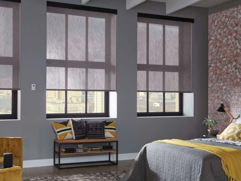 Graber solar shades blocking UV rays and reducing glare in bedroom for St. Louis, MO and nearby homes