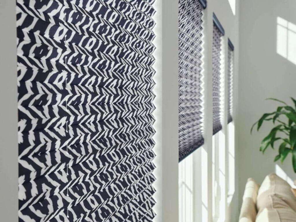 Pleated shades are a type of window covering made from fabric that’s folded in a series of crisp pleats, similar to an accordion.