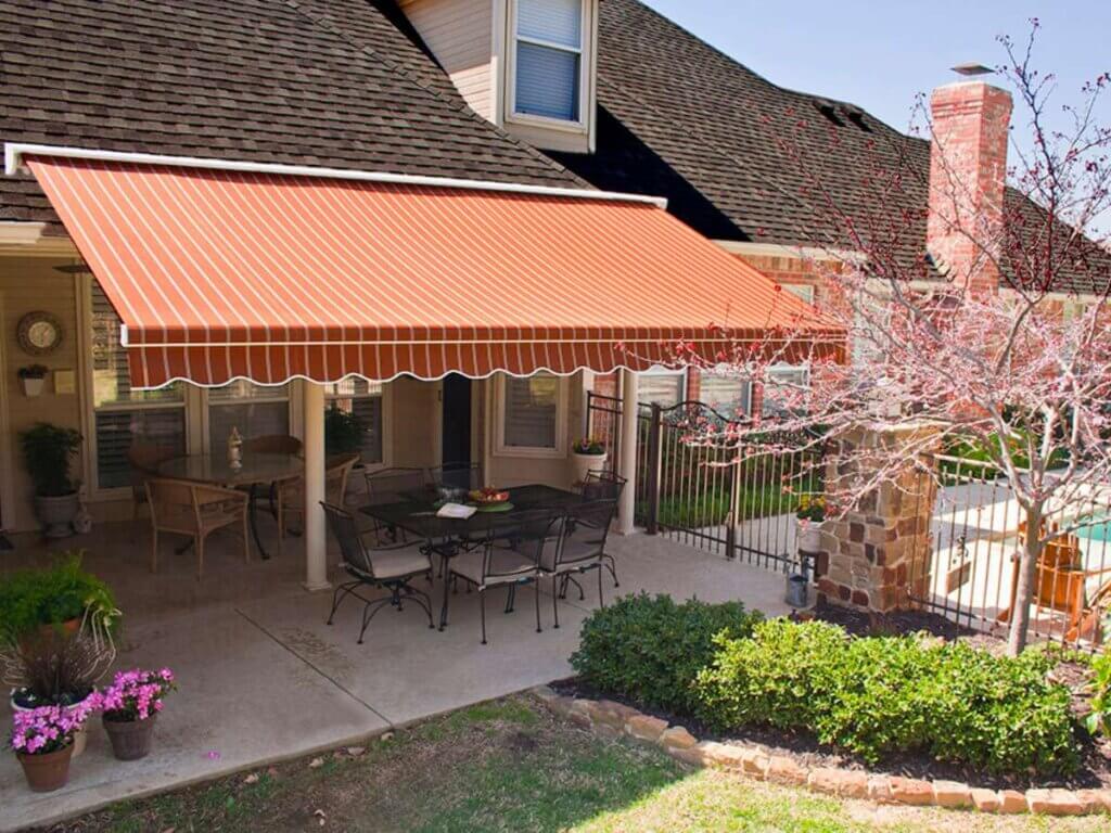 Orange Striped Retractable Awnings in Patio