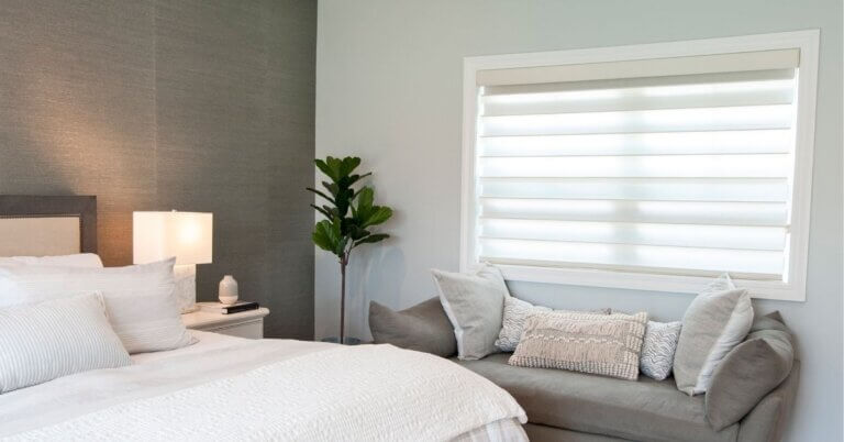 Norman sheer shades with soft fabric vanes providing elegant light filtering and privacy in bedroom for St. Louis, MO homes